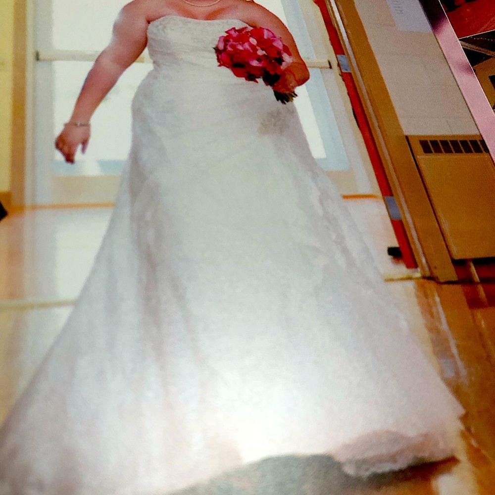 White wedding dress which was preserved and put in a box, corset straps